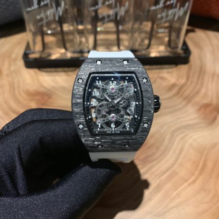 Richard Mille RM17-01 carbon fiber watch with skeleton dial, tourbillon, and rubber strap for comfortable summer wear.