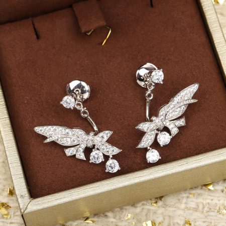 CHAUMET Laurel Earrings: Inspired by Josephine and Napoleon, these 925 silver earrings with diamonds and white gold celebrate the laurel's symbolism of victory and timeless elegance.