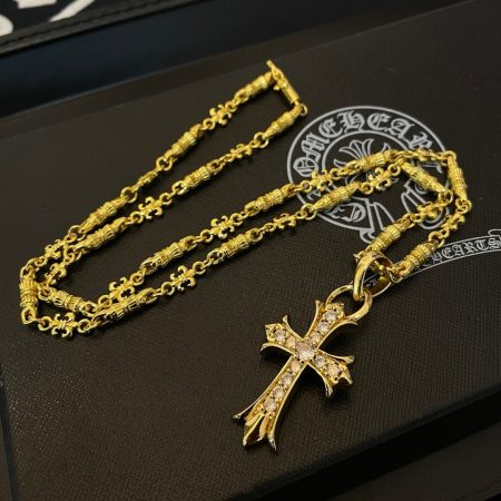 Chrome Hearts gold cross necklace with diamond accents, vintage design, unisex. High-quality craftsmanship, retro style.