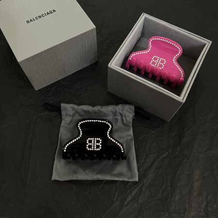 Balenciaga new hair claw clip, simple and elegant with gold finish, perfect for outfit pairing.
