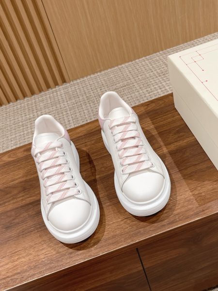 Alexander McQueen white sneakers, top version, stain and wrinkle resistant. Available in women's sizes 35-40, men's 40-45.
